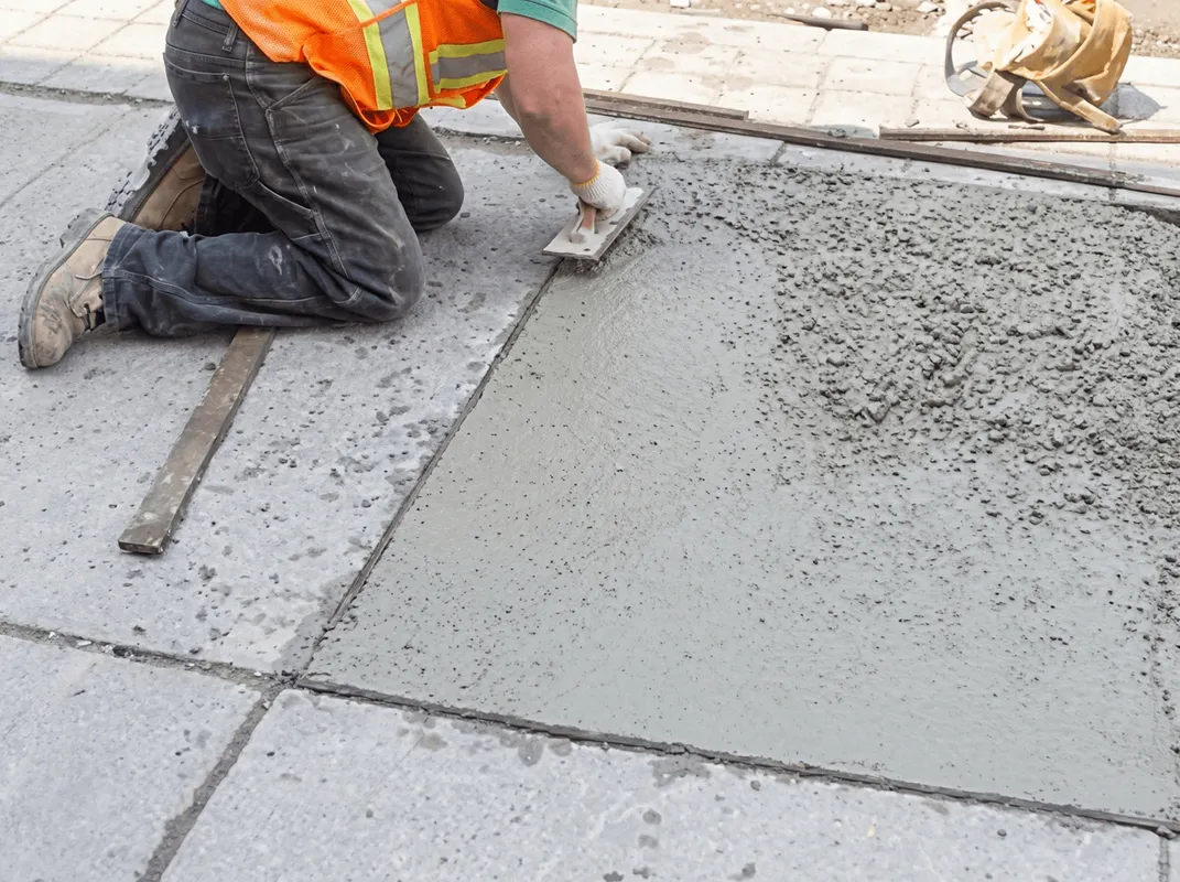Professional repairing a concrete floor in Ogden, UT